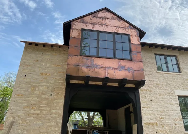 Copper metal panel facade on a stone building for Metal Roof Coating in Moosic